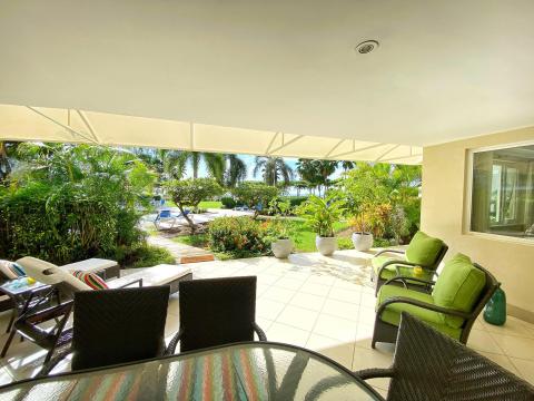 Palm Beach 211 Barbados Beachfront Vacation Condo Rental Covered Patio with Garden Views