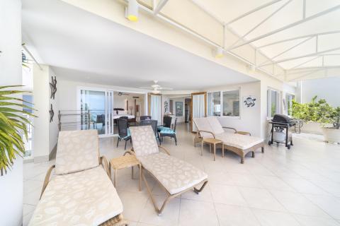 Palm Beach 502 Holiday Rental Barbados Patio with Lounge Chairs