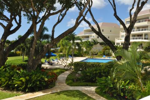 Palm Beach 211 Barbados Beachfront Vacation Condo Rental Gardens and Path To Pool