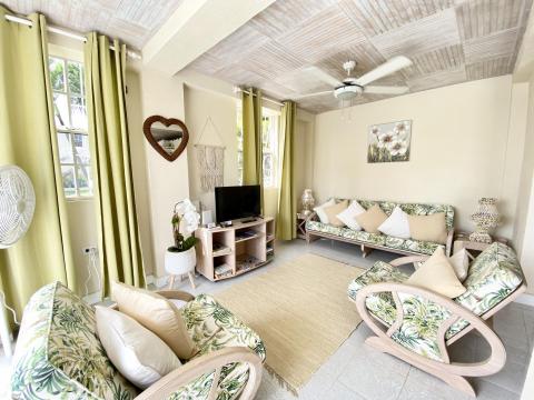 Heywoods 145 Barbados Vacation Rental Apartment Living Room with Seating and TV