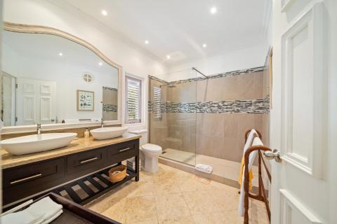 Spacious and luxurious master bathroom with modern shower and elegant design at Ixora, Royal Westmoreland, Barbados