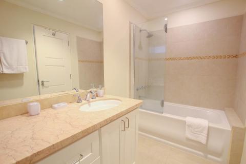Second bathroom at Palm Beach 109, Barbados, with floor-to-ceiling tiles and contemporary finishes.