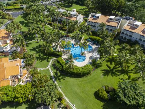 Another aerial view of Sugar Hill Resort, highlighting the resort’s luxurious villas, extensive gardens, and central pool area, capturing the serene atmosphere of this exclusive Barbados property.